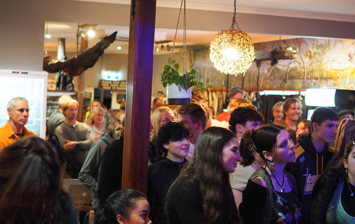Photo of crowd at Rock On for Climate Action 2024, Tomakin, NSW. Credit: J&S Design / Good Vibes Entertainment