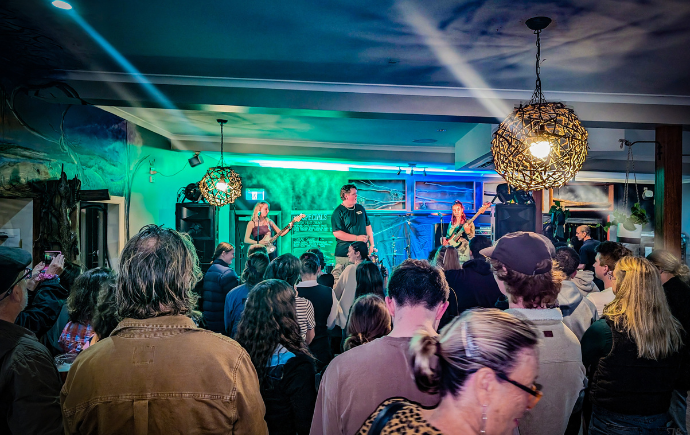 Photo of performers at Rock On for Climate Action 2024, Tomakin, NSW. Credit: J&S Design / Good Vibes Entertainment