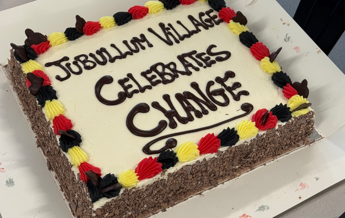 Photo of a cake that says 'Jubullum Village Celebrates Change